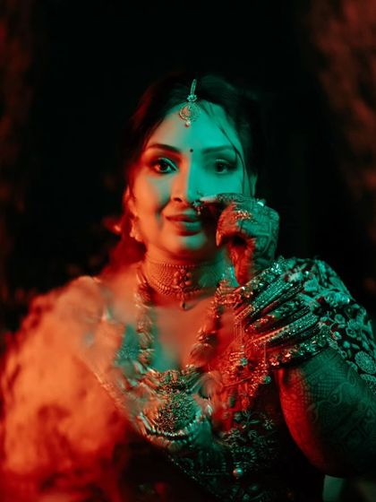 Another creative shot using colored lights, this time with a red and green smoke effect, giving the portrait an edgy, modern feel.