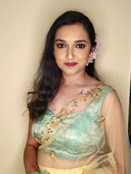 A simple and elegant non-bridal look. The makeup is soft and romantic, with pink tones and a matching lip.