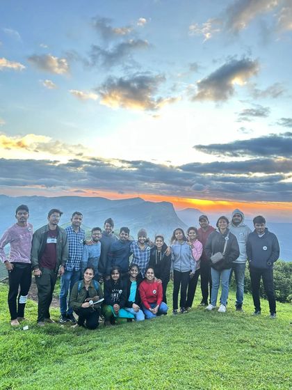 The group enjoying a beautiful sunset over the hills of Chikmagalur.