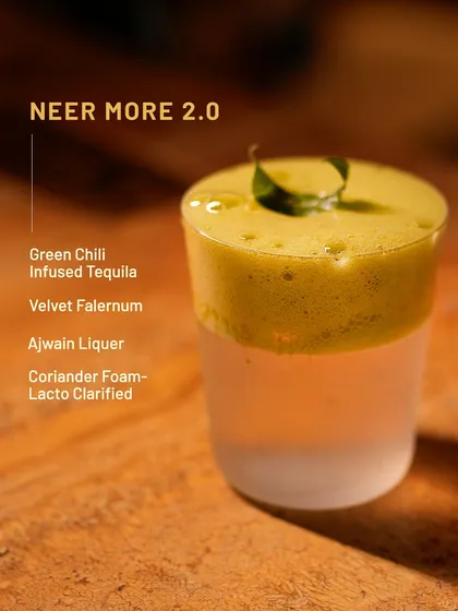 Neer More 2.0, a fiery twist on a classic South Indian refresher. We use green chili-infused tequila, ajwain liqueur, and a coriander foam to create this knockout pour.