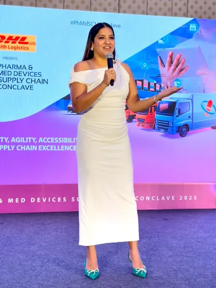 Explaining a logistical point during the Pharma & Med Devices Supply Chain Conclave. Visual aids on the screen behind me help in communicating complex ideas.