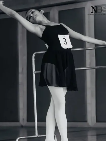 A shot from an audition or exam. The number pinned to my leotard is a familiar sight for any serious dancer.