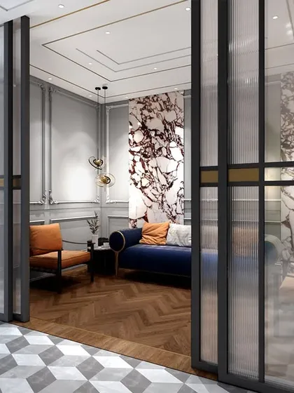A view of the waiting area in the lawyer's office, separated by a fluted glass partition. The design uses a mix of classic and modern furniture to create a welcoming and professional atmosphere.