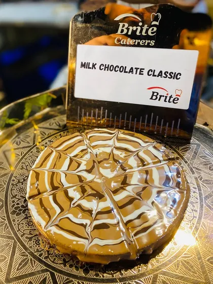 A close-up of the perfectly sliced milk chocolate classic waffle, a simple yet irresistible treat.