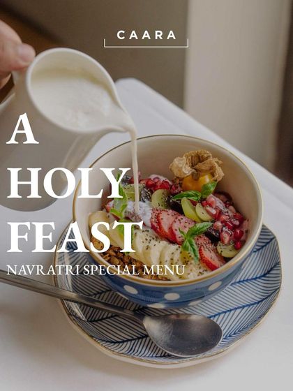 To honor the festival of Navratri, we offer a special "Holy Feast" menu. This image shows a beautiful smoothie bowl from our menu, which is free from onion and garlic.