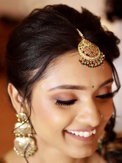 A close-up of Nony's Mehendi eye makeup. The soft brown eyeshadow and defined lash line create a look that is subtle yet impactful, perfect for a daytime celebration.