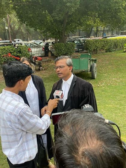 Providing a statement to a reporter outside the court, detailing the legal steps being taken in a significant ongoing case.