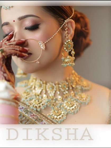 A celebrity-inspired bridal look. This image captures the elegance and poise of a classic bridal portrait, focusing on the delicate jewelry and soft makeup.