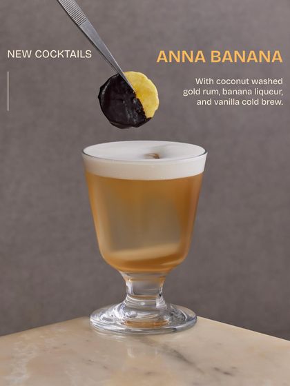 A closer look at the Anna Banana. The garnish, a banana chip dipped in chocolate, hints at the delicious blend of coconut rum, banana liqueur, and vanilla cold brew within.