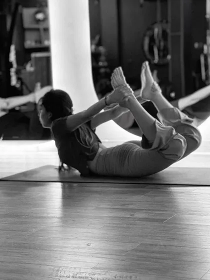 The Bow Pose (Dhanurasana) is an excellent backbend for strengthening the back muscles and improving posture. Here, a student demonstrates the pose with focus and control.