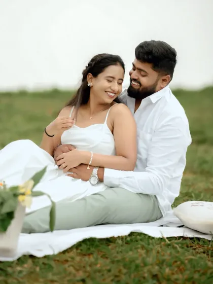 A sweet and serene pre-wedding picnic, with the couple sharing a happy, intimate moment.