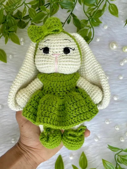 Look at this adorable bunny with her long, floppy ears and sweet green dress! I love when customers have unique ideas, and this long-eared bunny was a joy to bring to life. All my animal plushies are made with soft, baby-safe yarn, perfect for a little one's first friend.