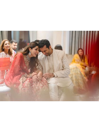 A candid shot of the couple sharing a private word. These are the quiet, storytelling moments that I specialize in capturing.