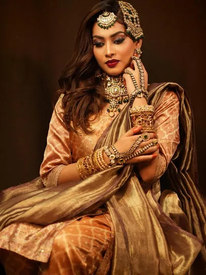 A seated portrait that captures the luxurious feel of the entire bridal ensemble created by our student.