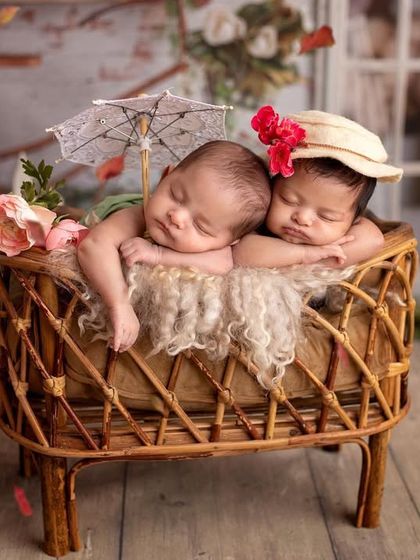 We added a tiny parasol and different hats to give the parents a variety of shots from their themed twin session. Every detail is planned to make the photos unique.