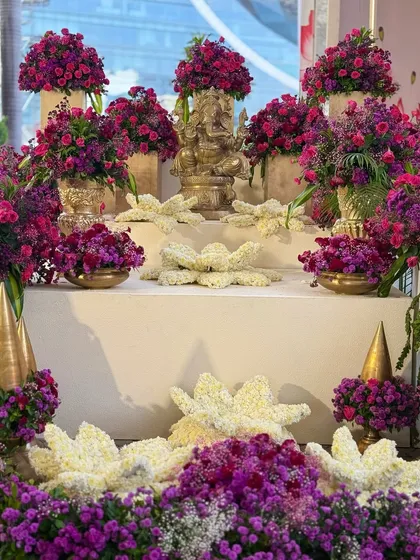 Different angles of the auspicious welcome corner. The Ganesha idol, a symbol of new beginnings, is beautifully adorned with flowers, setting a blessed tone for the celebration.
