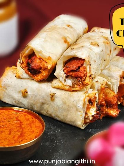 Our famous Tandoori Chaap, all wrapped up in a soft roll and served with a side of our signature tawa gravy for dipping. It's a full meal on the go.