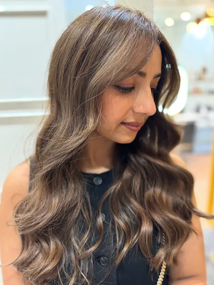 A walnut hair colour balayage, a unique shade of brown with cool, earthy undertones.
