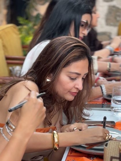 A candid moment of a guest writing her heartfelt wishes. I love incorporating activities that create meaningful keepsakes for the family.