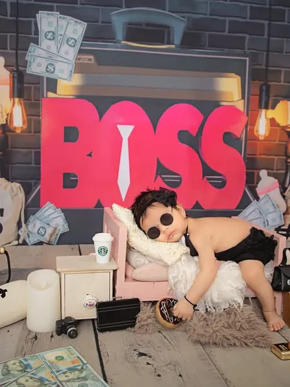 Let's have some fun! My studio is equipped for creative and playful themes like this "Boss Baby" setup, adding a touch of humor and personality to your newborn's first photoshoot.