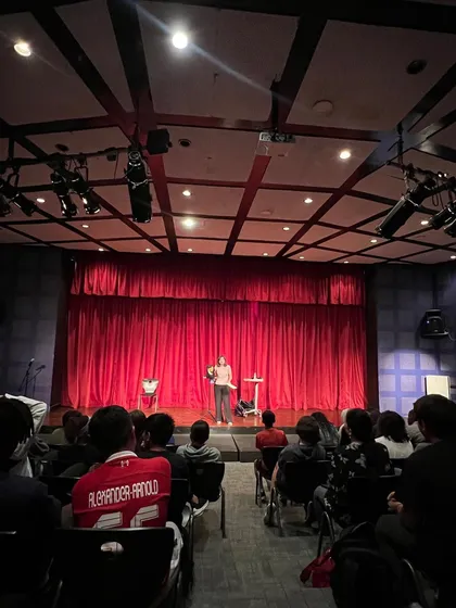 Another view of the stage and the wonderful student audience. Performing at my son's old school was a special experience.