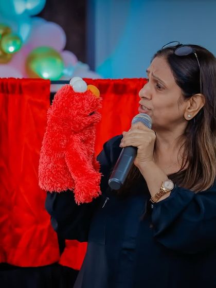 A puppeteer brings Elmo to life, interacting directly with the audience. This personal touch makes the show even more special for the kids.