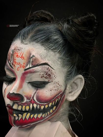 "Hello Georgie." A chillingly realistic clown look. The detailed teeth and cracked skin effect showcase my skills in special effects and character makeup.