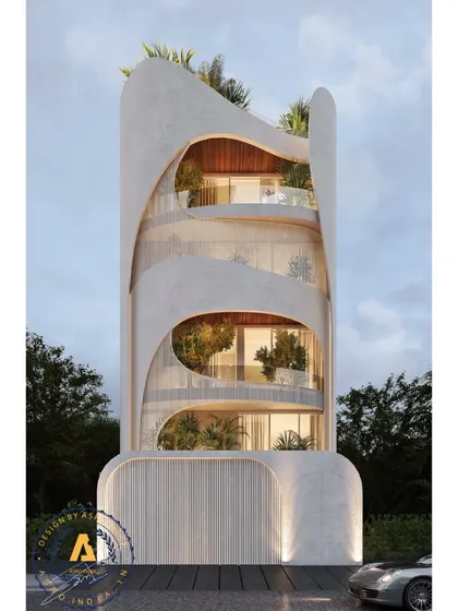 This Delhi residence is a bold expression of biophilic design, inspired by nature's fluidity. Flowing vertical gardens and lush terraces transform the exterior, while the interplay of solid and open spaces creates a sense of movement.