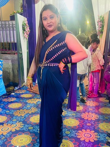 A stylish navy blue draped saree-gown. This rental outfit gives you the elegance of a saree with the comfort and ease of a gown.
