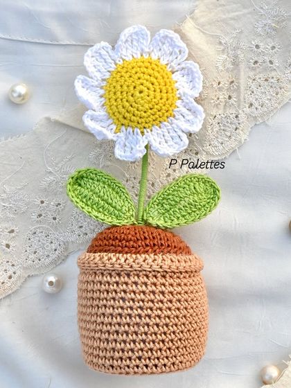 Our full-size potted crochet daisy, a charming piece of decor that brings the freshness of a garden indoors, forever.