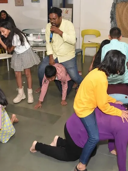It's all fun and games here. Parents and kids join in on the activities during a party, showing that our events are designed for the whole family to enjoy together.