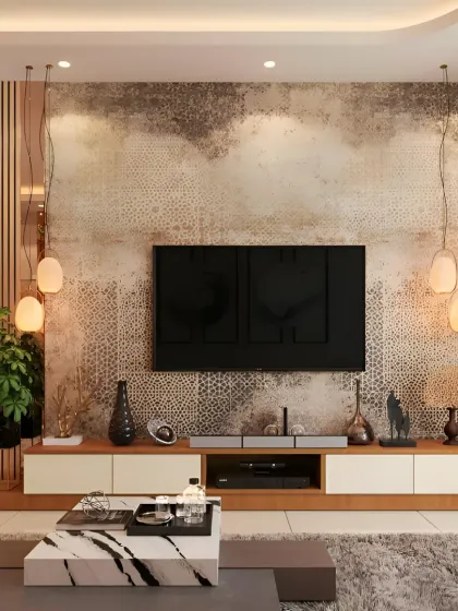 This luxurious living room features a textured accent wall behind the TV, complemented by elegant pendant lights. The low console and marble coffee table add to the sophisticated, modern aesthetic we crafted for this home.