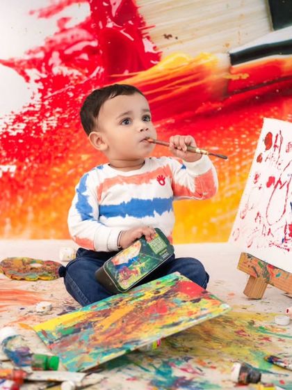A little Picasso at work. This messy paint theme is a fantastic way to capture a child's creativity and have a lot of fun in the process.