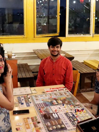 A complex game of 'Vinhos' unfolds at one of our tables. I love seeing our community dive into deep, strategic board games.