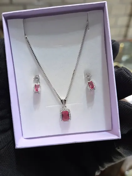 A simple and elegant silver pendant set with a pink rectangular stone. A lovely gift for someone special.
