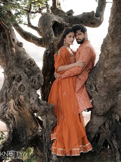 An intense and romantic portrait of actor Tanuj Virwani and his partner Tanya during their Lonavala pre-wedding shoot. Their embrace among the gnarled branches of an old tree creates a powerful and earthy image.