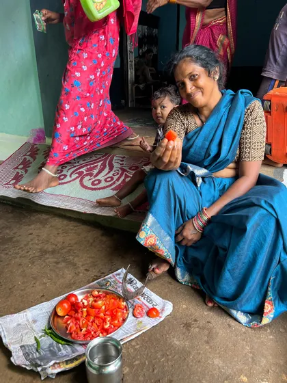 Preparing fresh tomatoes for the chutney. The joy and pride in preparing a meal for guests, even unexpected ones, was visible in every action.