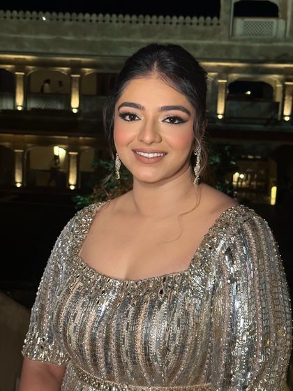 A closer portrait, showing the details of the winged liner and the soft, glowing skin.