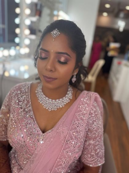 A close-up of Surya's reception makeup, with a focus on the shimmery pink eyeshadow. The look is soft, romantic, and perfectly blended.