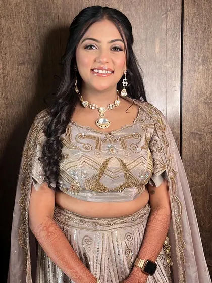 The complete look for Aayushi's engagement. The makeup is glamorous yet soft, letting her natural beauty shine through.