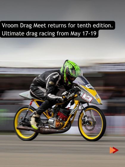 A close-up of the yellow classic racer, showcasing the skill and passion required to pilot these legendary machines at competitive speeds.