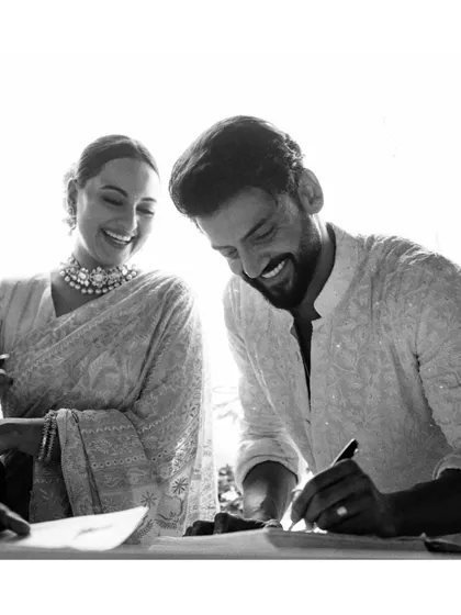 The moment it becomes official. Sona and Zaheer share a smile as they sign their marriage registration papers, surrounded by the love and support of their families.