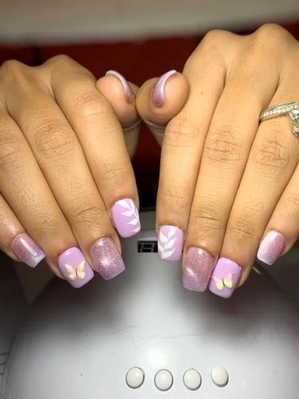 A sweet design with a shimmery lavender base, white leaf prints, and small butterfly accents.
