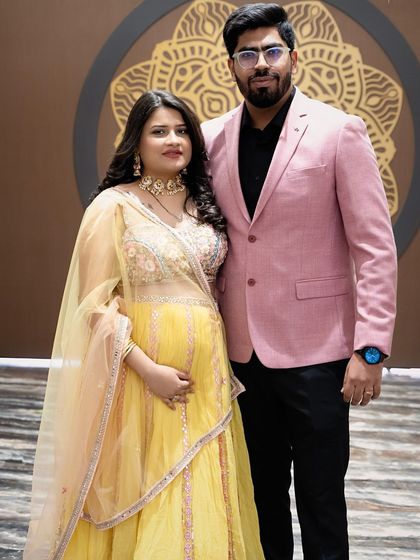 A lovely portrait of the happy couple at their baby shower. They are surrounded by friends and family, and their smiles show the love and excitement in the air. These are the memories they will share with their child one day.