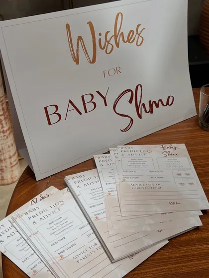 We designed custom stationery, including these 'Wishes for Baby Shmo' cards, to create a cohesive and interactive experience for the baby shower guests.