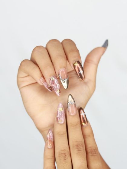 Another angle of the artistic pink marble and chrome nail set.
