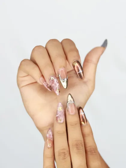 Another angle of the artistic pink marble and chrome nail set.