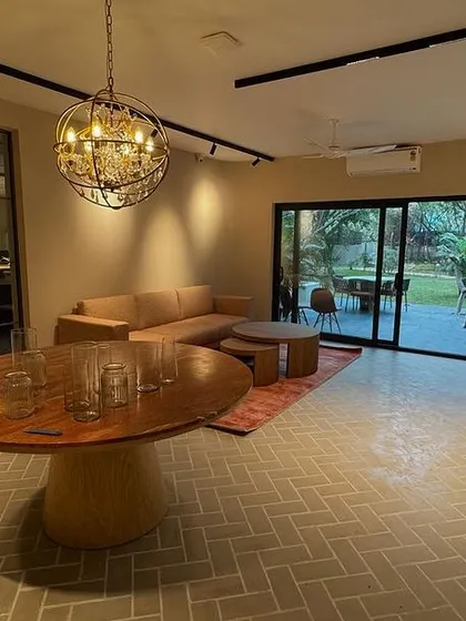 For this office, we designed a relaxed and modern environment where the indoor ambiance aligns with the natural surroundings. The open-plan waiting area features comfortable seating, earthy tones, and a glass partition leading to the main workspace. A large sliding door opens to a green patio, creating a perfect setting for a stress-free and inspiring workday.