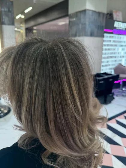A close-up of the cool blonde tones, showing the intricate blend of highlights and lowlights that create this dimensional look.