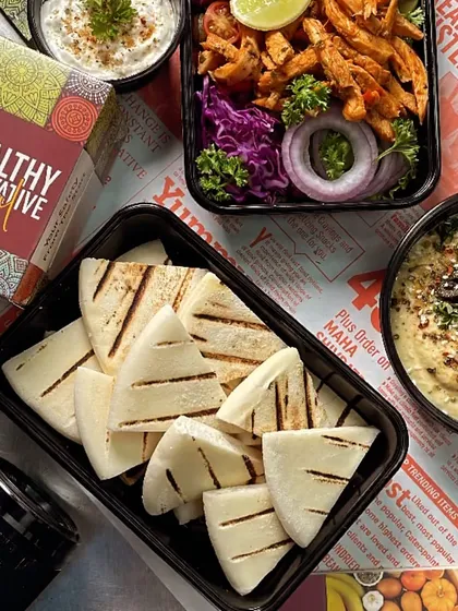 Our Pita and Hummus meal, beautifully arranged and ready for delivery. It's a perfect, healthy option for your dinner or a small gathering.